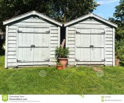 two-tool-sheds-two-wooden-garden-sheds-lawn-109702851.jpg